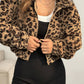 Leopard print vegan fur cropped jacket with long sleeves worn zipped on a studio model