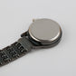 Back of the nurse fob watch showing the flat bar with a brooch pin and the case back