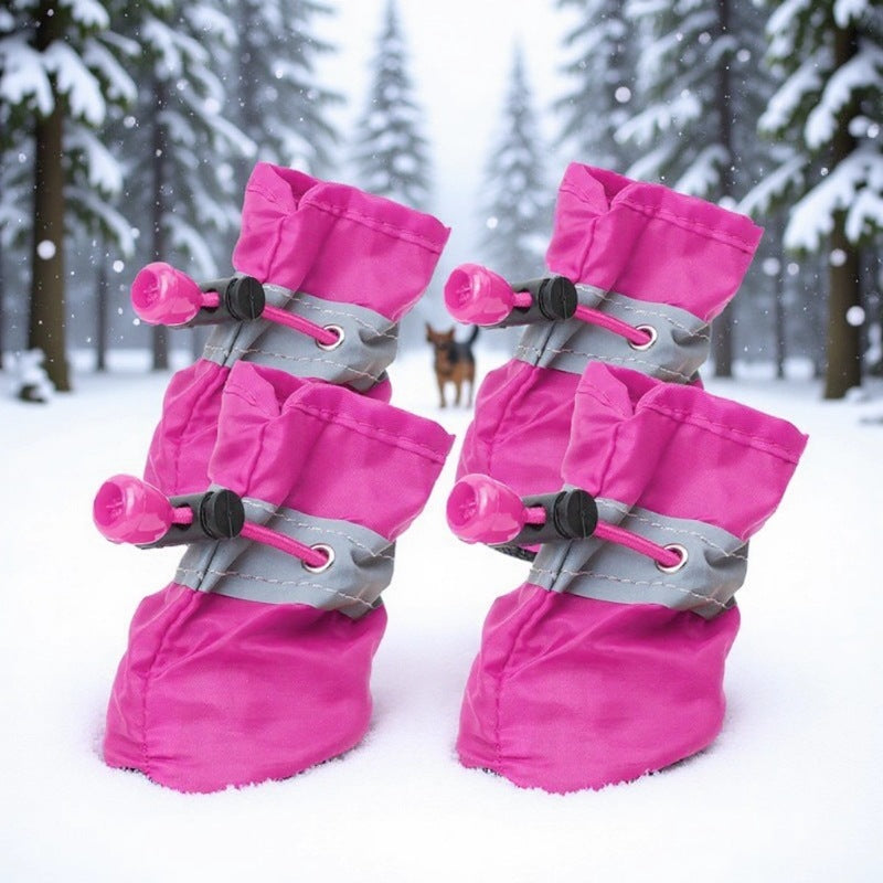 Pair of red dog boots with soft fleece lining shown at the collar