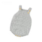 Pink knit baby romper showing the buttoned shoulder straps and open pointelle pattern