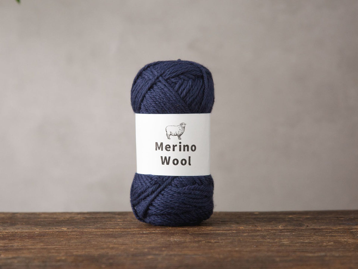 Merino wool yarn ball band showing the one hundred percent merino label