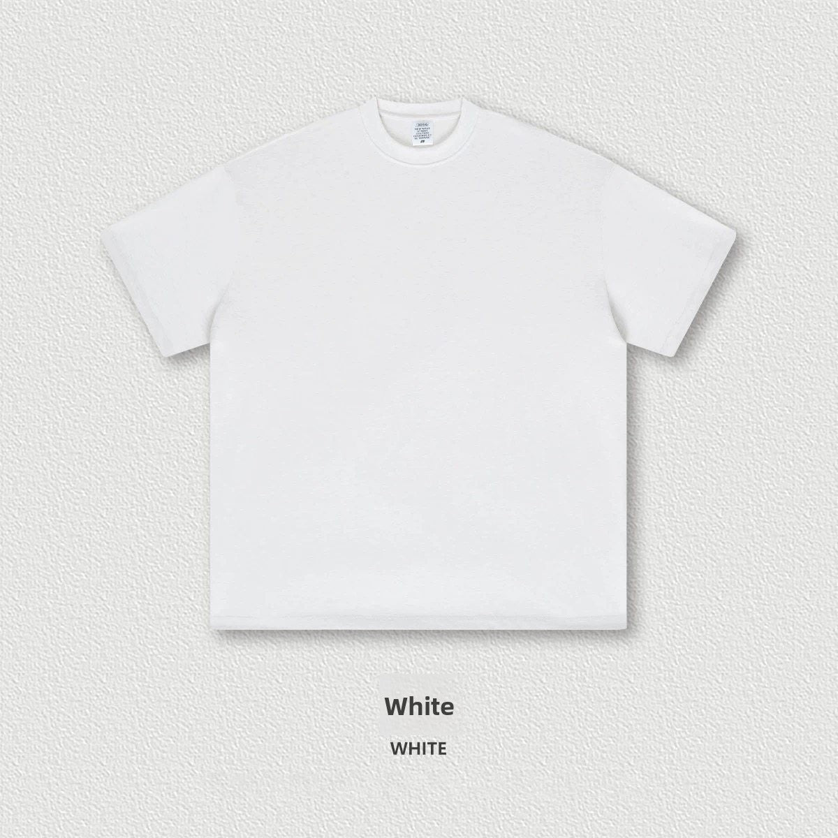 Heavyweight cotton oversized crew neck short sleeve tee in a solid color on a plain background