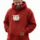 Red fleece pet pouch hoodie on a man with a cat peeking out of the front pouch