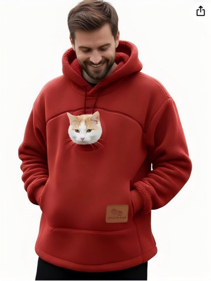Red fleece pet pouch hoodie on a man with a cat peeking out of the front pouch