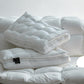 White quilted bed pillow with breathable 3D mesh gusset side band close up