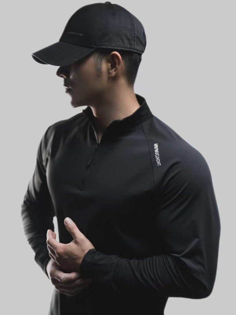 Side view of the half-zip sport shirt showing trim cut and long sleeve