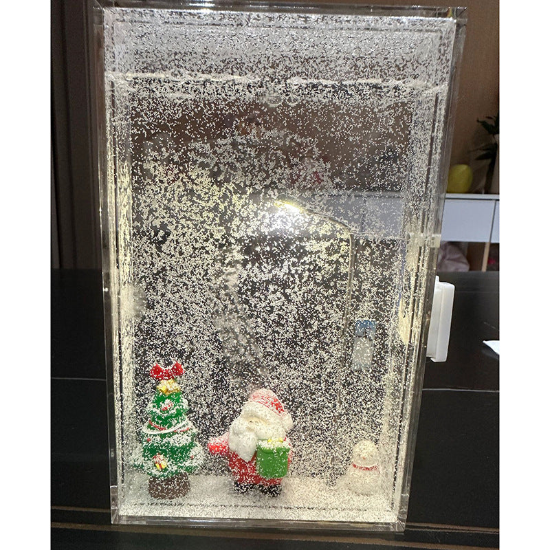 Close view of the LED street lamp lit inside the clear Christmas scene box with faux snow