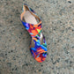 Multicolor print T-strap peep toe sandal with rear zipper on a gray stone ground, EU 41 option