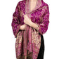 Magenta paisley tassel shawl wrap worn draped over the shoulders with tasseled fringe ends