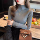Ribbed mock neck long sleeve knit pullover shown on a model in a soft macaron color