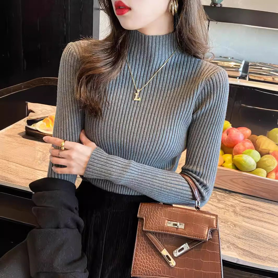 Ribbed mock neck long sleeve knit pullover shown on a model in a soft macaron color