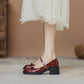 Glossy patent look Mary Jane heel showing round toe and instep buckle strap