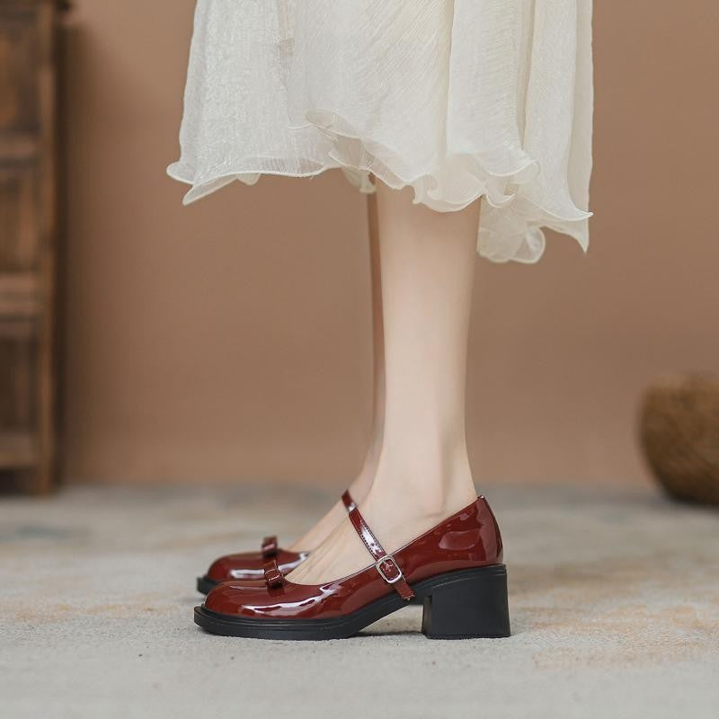 Glossy patent look Mary Jane heel showing round toe and instep buckle strap