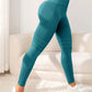Womens yoga leggings with a wide high waistband and a scrunch back seam