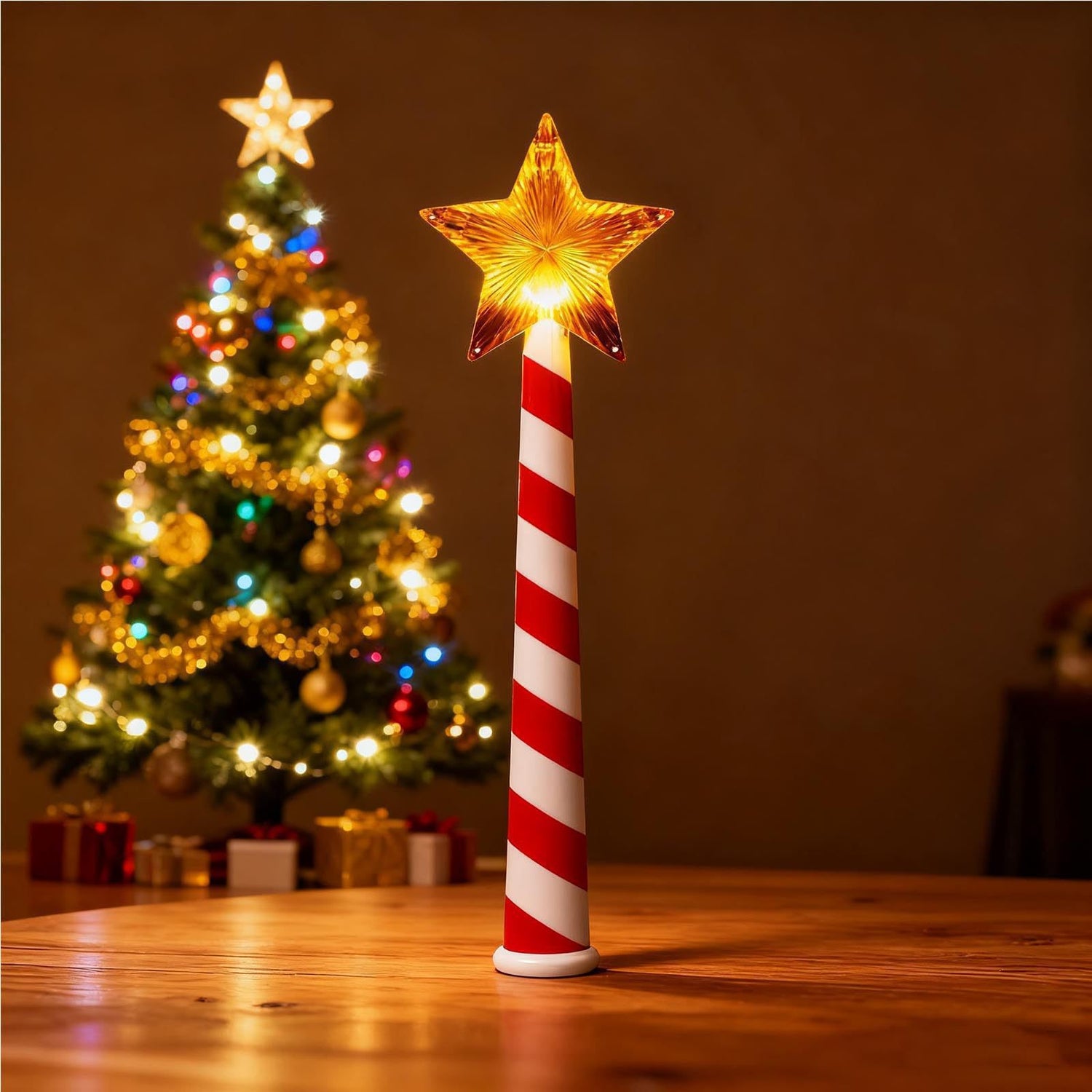 Glowing star Christmas wand stood on a table beside a lit tree, candy cane striped handle