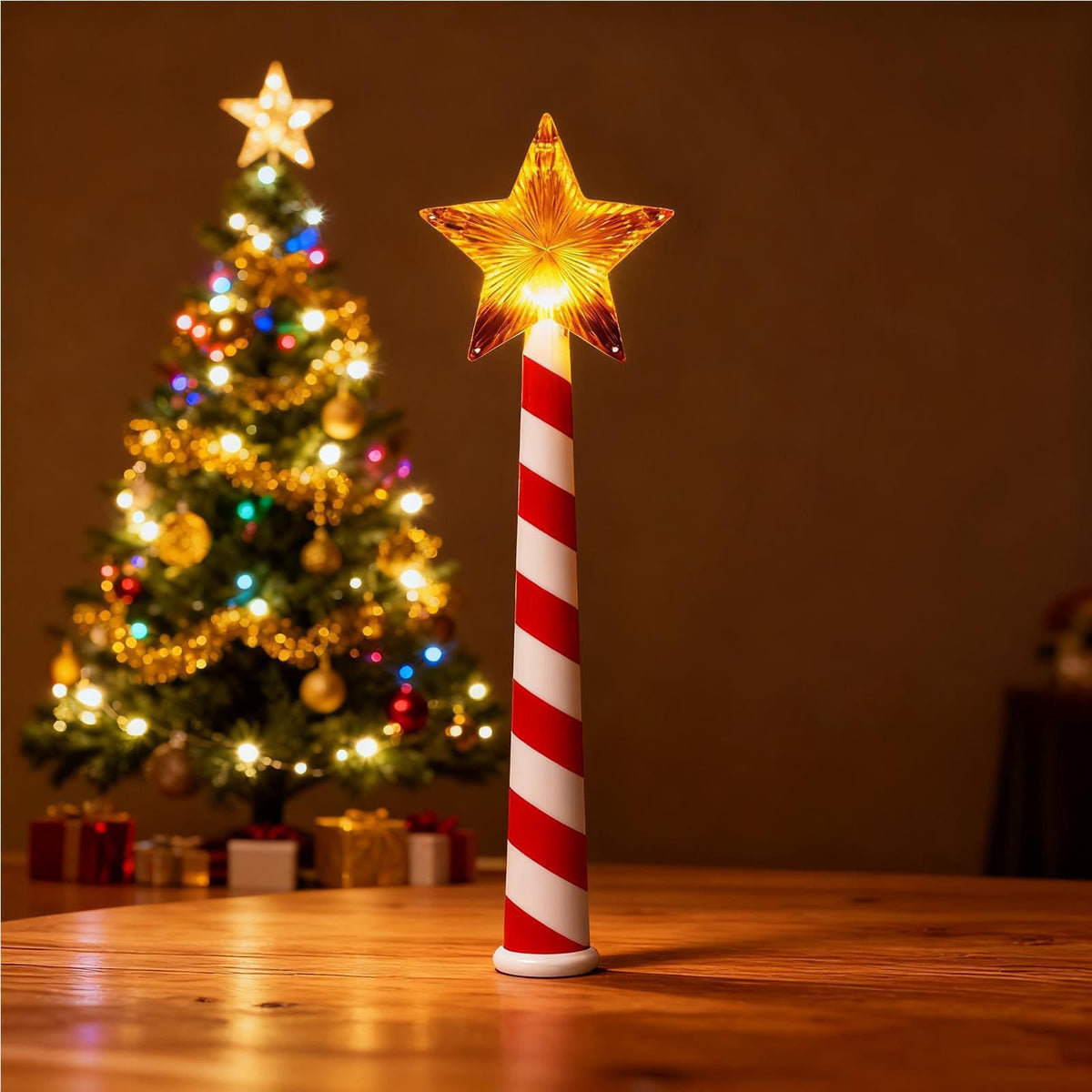 Glowing star Christmas wand stood on a table beside a lit tree, candy cane striped handle