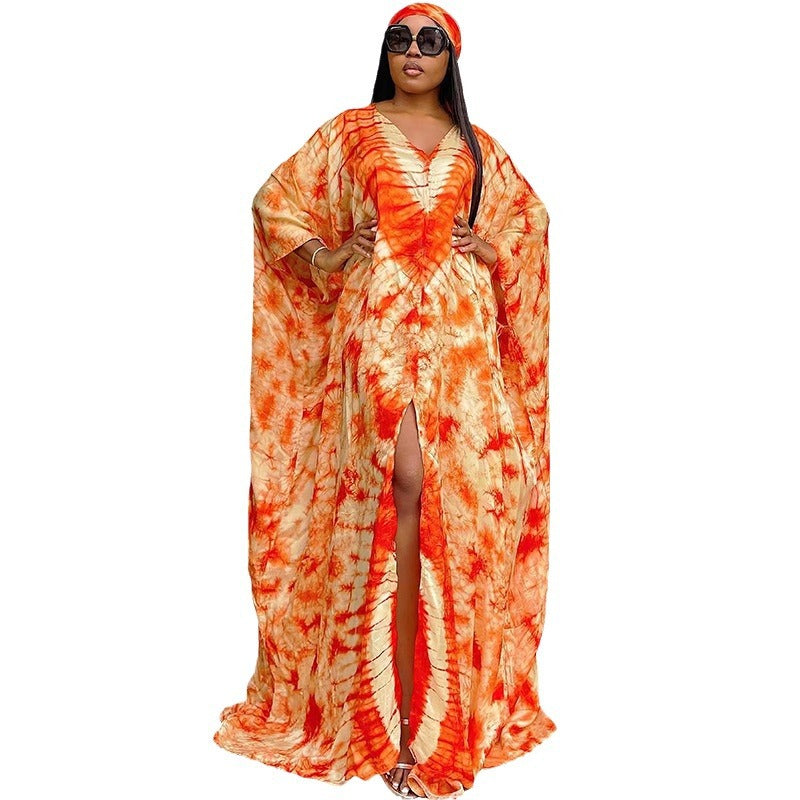 Loose free size tie dye kaftan maxi dress in a smooth satin finish fabric on a standing model