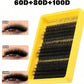 Hand placing a single black lash cluster along the lash line with tweezers