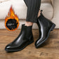 Man in striped trousers wearing black slip-on Chelsea boots, flame icon Add cotton for warmth