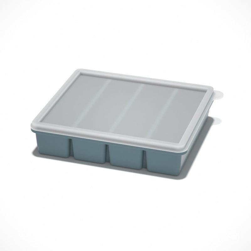 Flexible platinum silicone ice cube tray with the lid lifted off for portioning purees