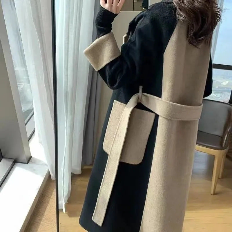 Side view of the belted colour block coat with camel patch pocket and self tie belt