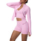 Barbie pink seamless yoga set showing the stand collar zip jacket, cropped tank and matching shorts