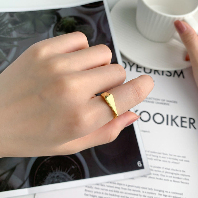 Heart titanium steel ring side profile showing band thickness and heart shape