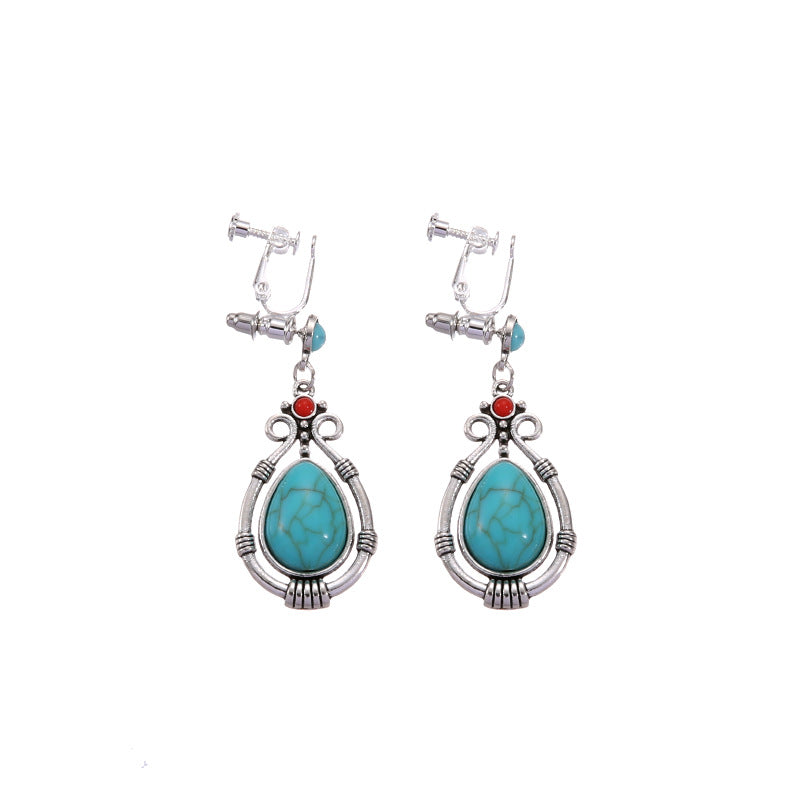 Boho vintage clip-on drop earrings with fringe and bead accents, zinc alloy build, studio image on white background