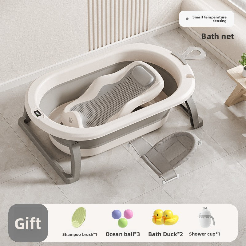 Baby bathtub with mesh bath rack and a gray hammock bath net lying next to the tub