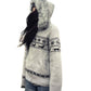 Grey Fair Isle zip cardigan with faux fur hood, ribbed hem and side pocket on a cut out figure, side view