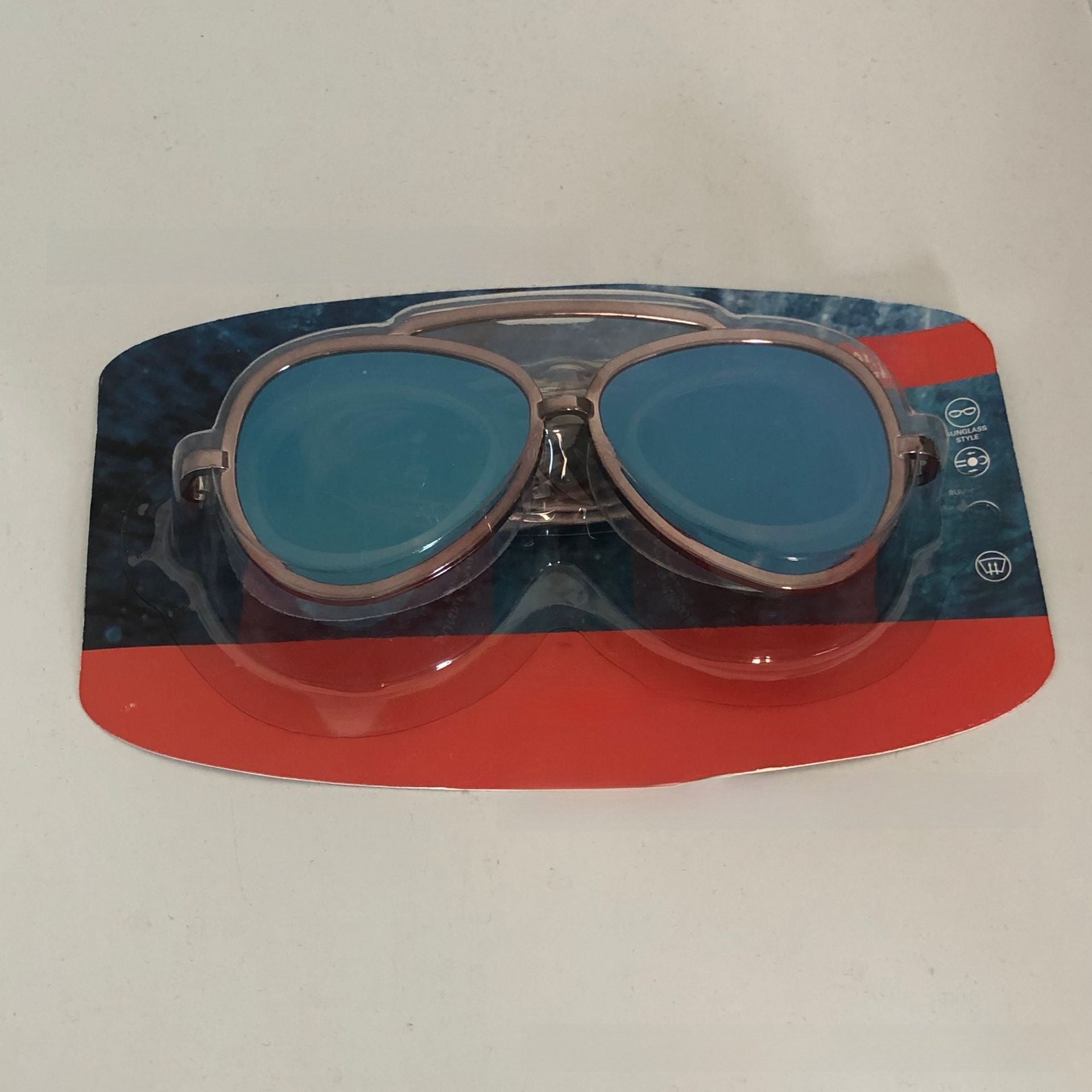 Polycarbonate mirror lens swim goggles in an aviator shape on a plain backdrop