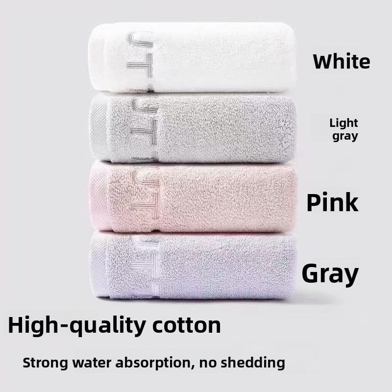 White cotton hand towel with a tone on tone embroidered row along one end