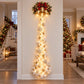 Illustrated Christmas wall display with a red ribbon bell above a trail of lights and stars, Bell option