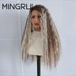 Side view of a long textured wave synthetic wig with brown and platinum blonde streaks on a mannequin