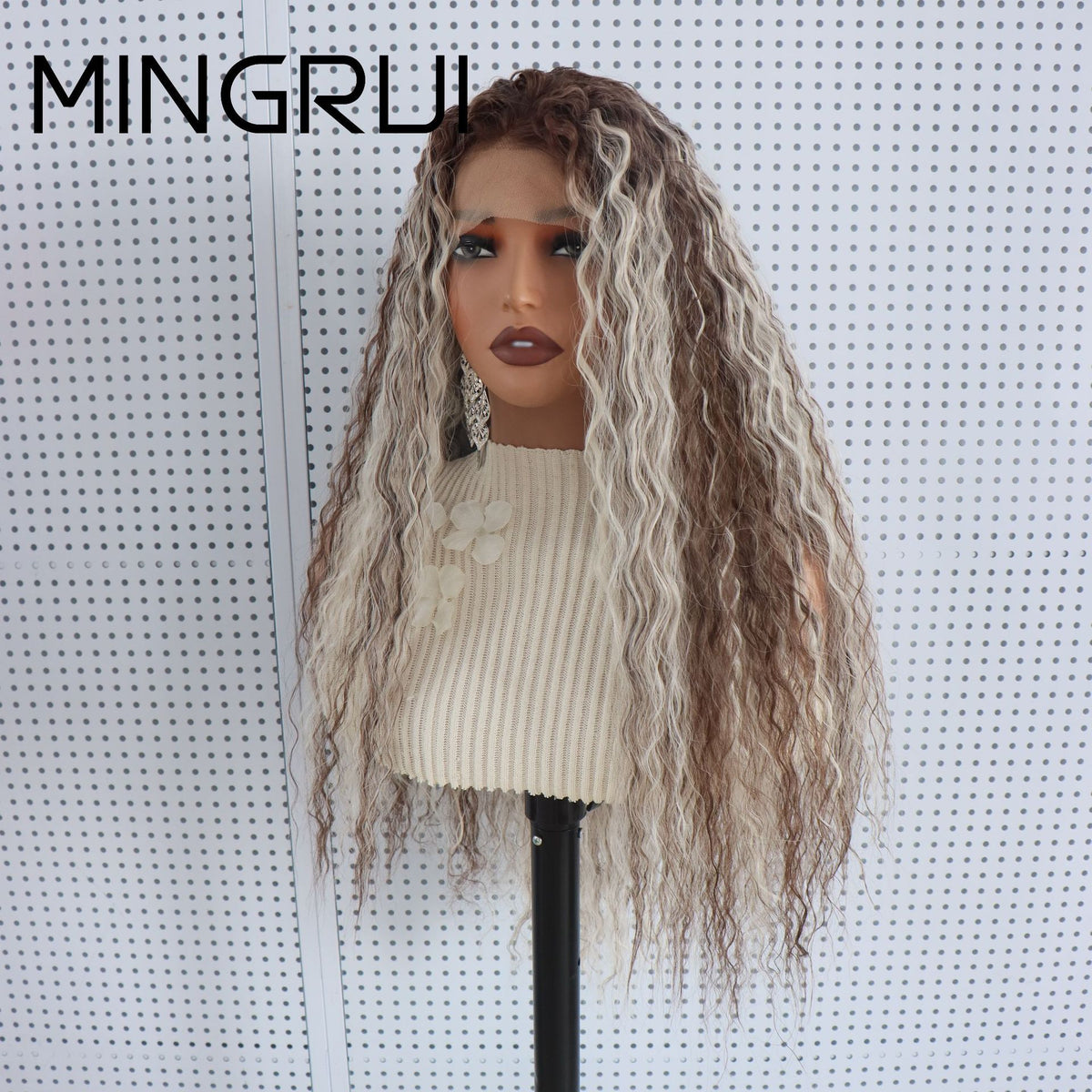 Side view of a long textured wave synthetic wig with brown and platinum blonde streaks on a mannequin