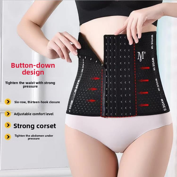 Black waist trainer worn at the waist, front view of the six row thirteen hook closure being fastened