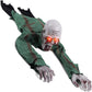Full crawling zombie prop on a white background in a torn green robe with glowing red eyes