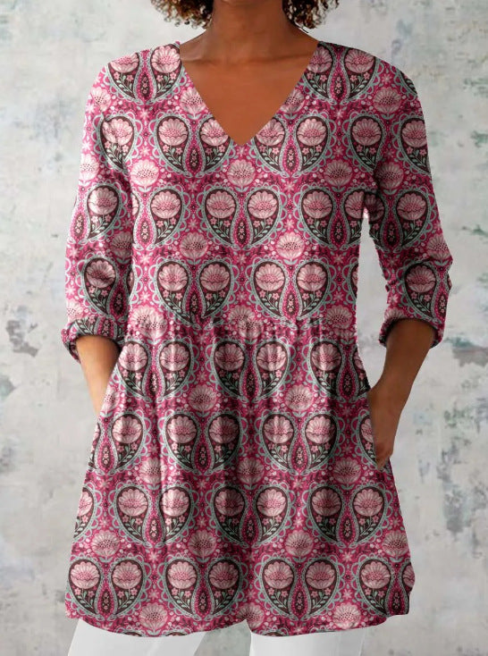 Floral print V neck tunic top with the peplum skimming the waist and hip