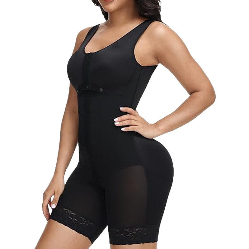 Black full body shaping bodysuit on a model with wide straps, chest snaps, mesh thigh panels and lace hems