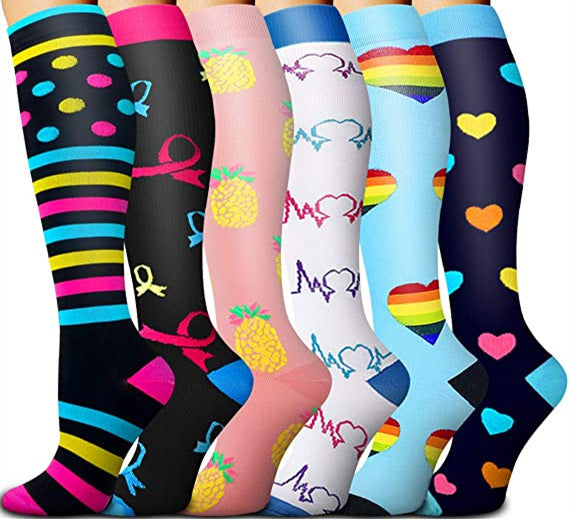 Assorted athletic compression socks in floral, animal and geometric prints