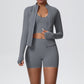 Dark gray three piece sports set, cropped scoop neck tank, high waist shorts and zip jacket