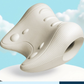 Ivory White contoured foam neck pillow with textured surface, raised nodes and round opening against a sky