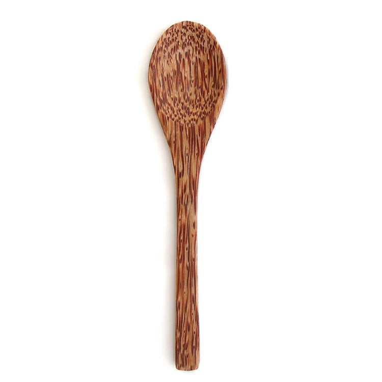 Coconut wood spoon with a speckled grain on a white background, spoon option photo