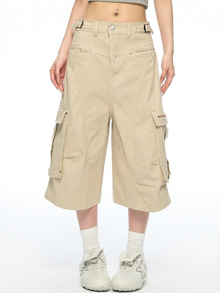 Khaki baggy cotton cargo shorts front view with side belt tabs and flap pockets