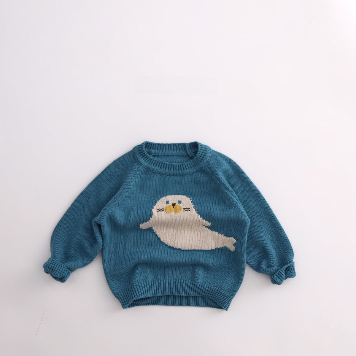 Blue cotton knit kids sweater with cream seal motif, ribbed neck and cuffs, for height 100cm