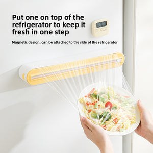 Food wrap dispenser front view showing the slide cutter and film slot, 36cm housing