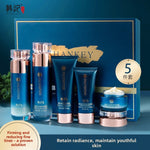 Hankey Polypeptide five piece set with two bottles, a cleanser tube, a BB cream tube and a cream jar beside a blue gift box