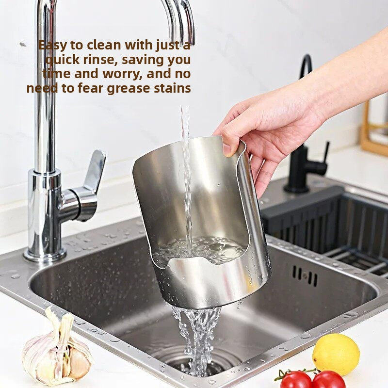 Hand rinsing the stainless steel kitchen holder under a running tap over a stainless steel sink