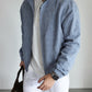 Men's linen stand collar jacket shown from the side, stand collar and sleeve in profile
