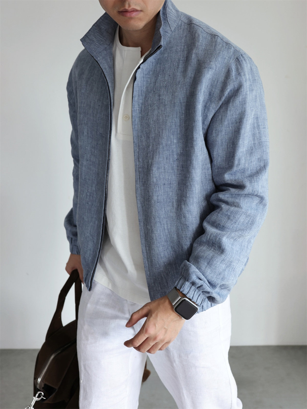 Men's linen stand collar jacket shown from the side, stand collar and sleeve in profile